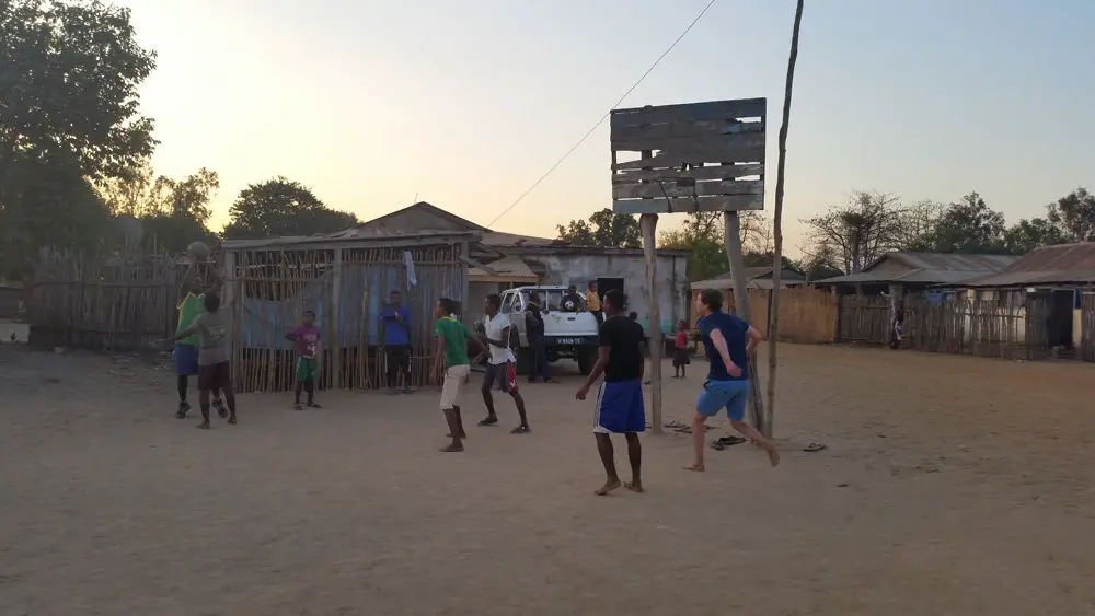 Jesse playing basketball with the locals.
