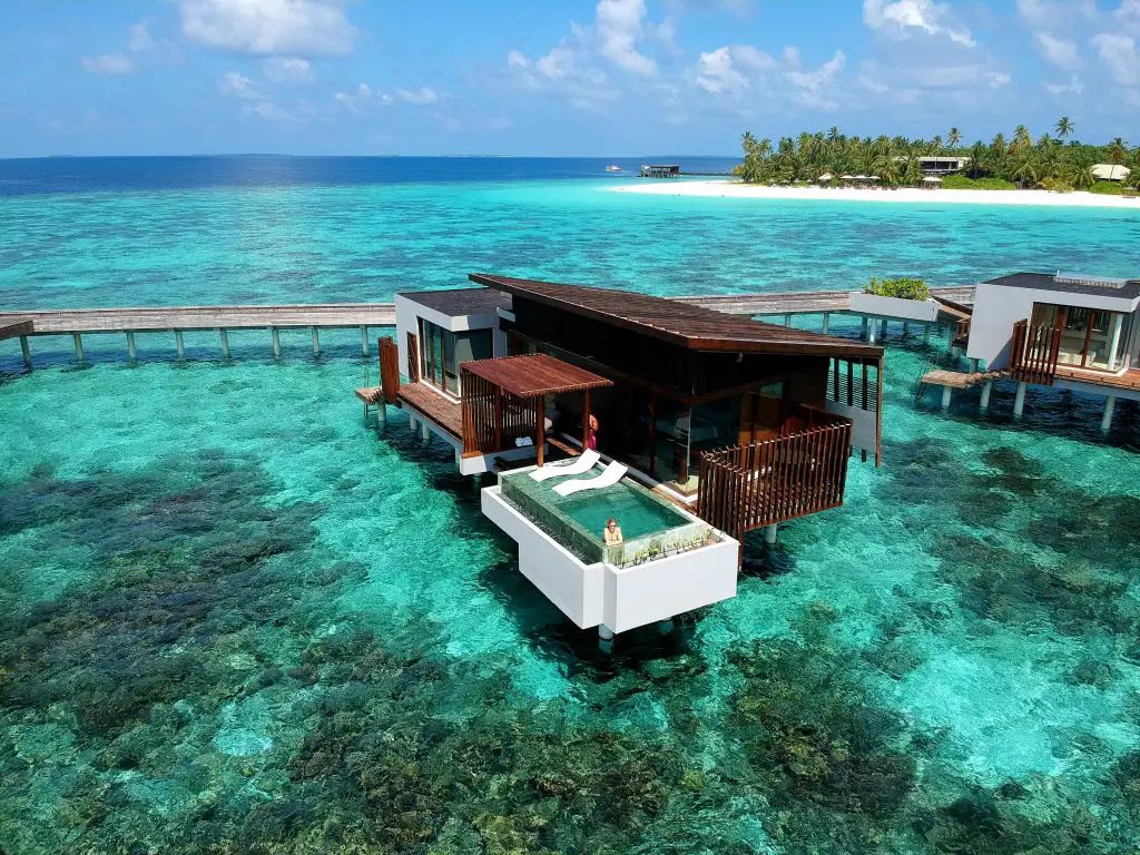 Maldives overwater sunset villa park hyatt hadahaa drone