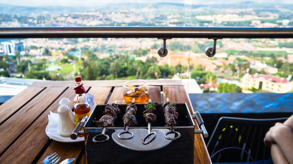 Eating lunch with a view at the rooftop hotel Ubumwe hotel Kigali rwanda