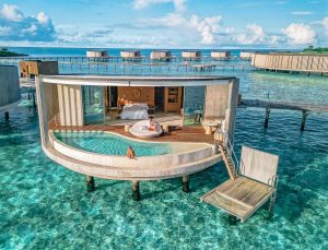 Ritz Carlton Maldives resort overwater villa drone